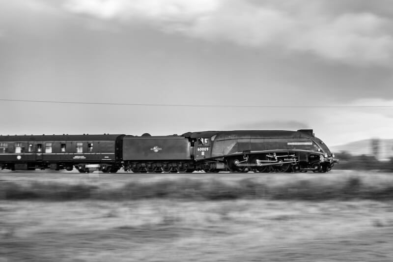 LNER A4 No. 60009 Union of South Africa is panned at speed along the Cross Country route near Tewkesbury, Gloucestershire with the return Cathedrals Express From Worcester Shrub Hill to London.